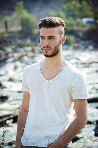 Portrait of handsome young man in white t-shirt