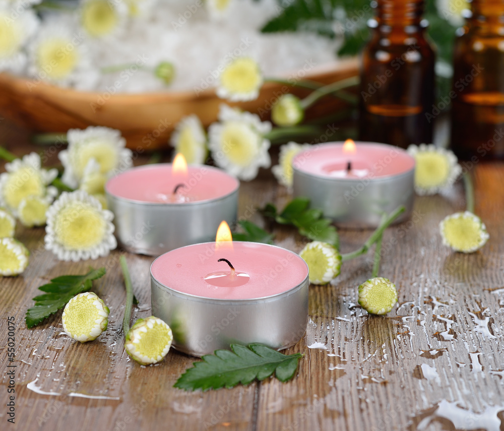 Burning candle and flowers Burning candle and flowers