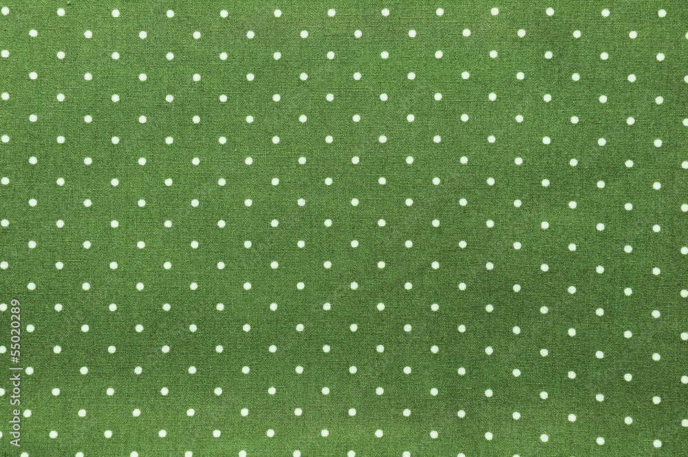 Seamless polka dots pattern on green fabric background Seamless polka dots pattern on green fabric background