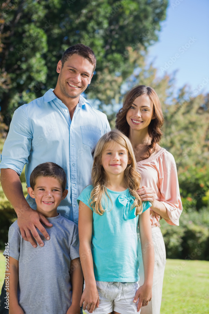 Happy family standing in the countryside Happy family standing in the countryside