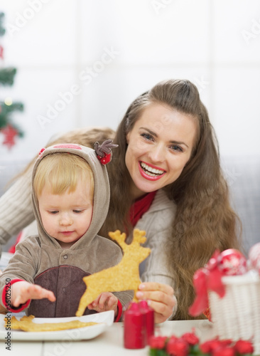 Happy mother and baby spending christmas time together