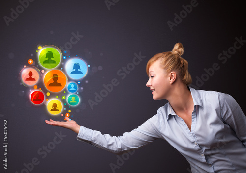 Social network icons in the hand of a businesswoman