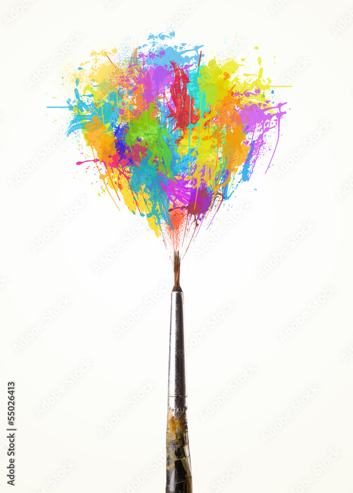 Obraz premium Brush close-up with colored paint splashes