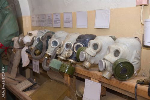 old gas masks in military soviet bunker photo