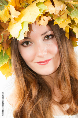 Beautiful fall woman. Portrait of girl with autumn wreath