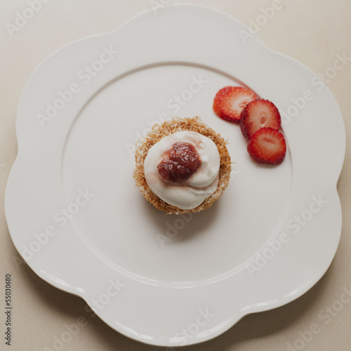Kadaif dessert with whipped cream and strawberry jam