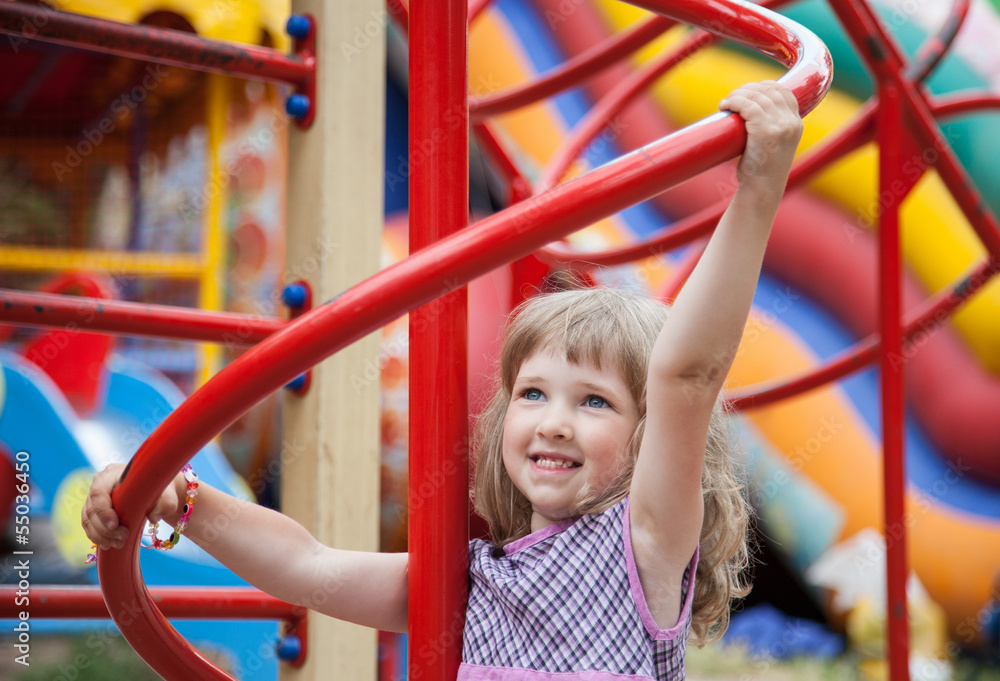 Active little girl playing in a stadium Active little girl playing in a stadium
