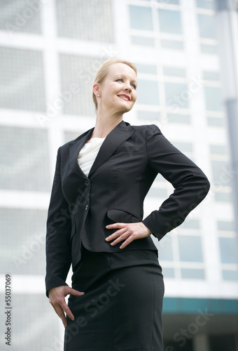 Businesswoman standing outside the office building