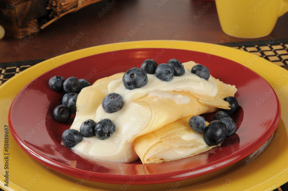French style crepes with cream and blueberries French style crepes with cream and blueberries
