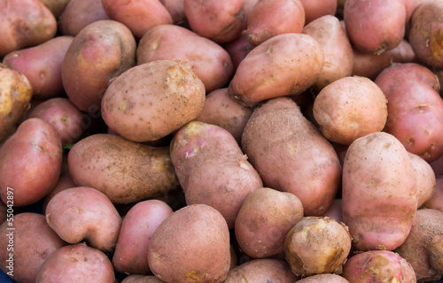 Potato on pile on green market