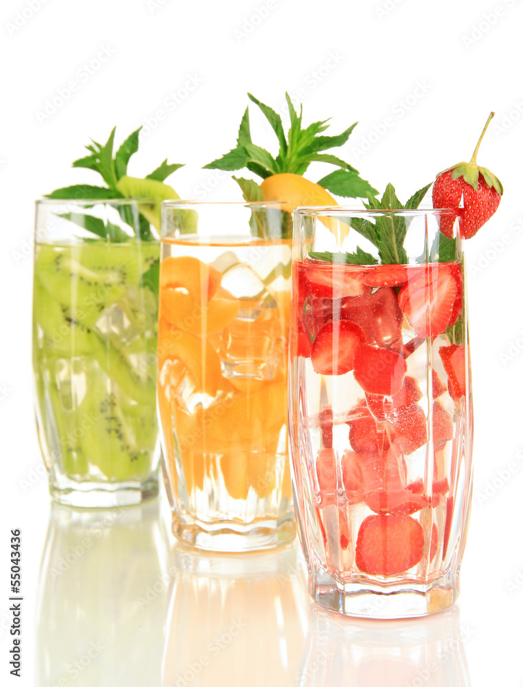 Glasses of fruit drinks with ice cubes isolated on white Glasses of fruit drinks with ice cubes isolated on white