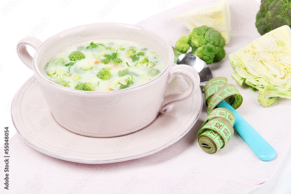 Cabbage soup in plate on napkin isolated on white Cabbage soup in plate on napkin isolated on white