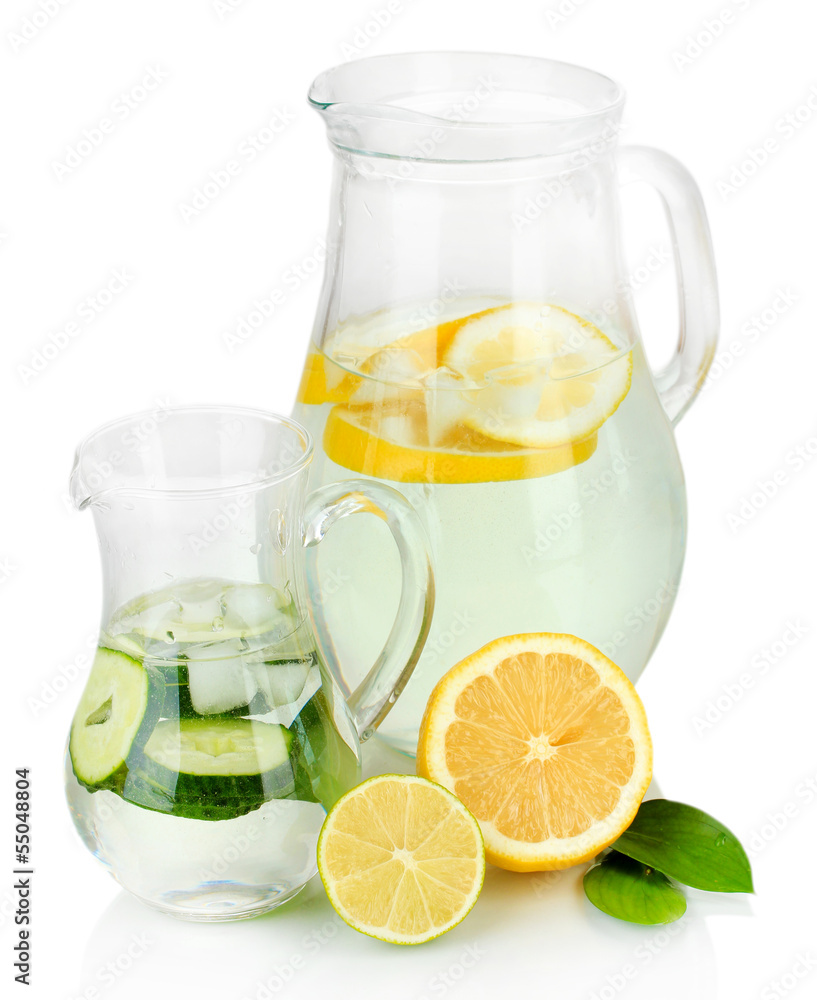 Cold water with lemon, cucumber and ice in pitchers isolated