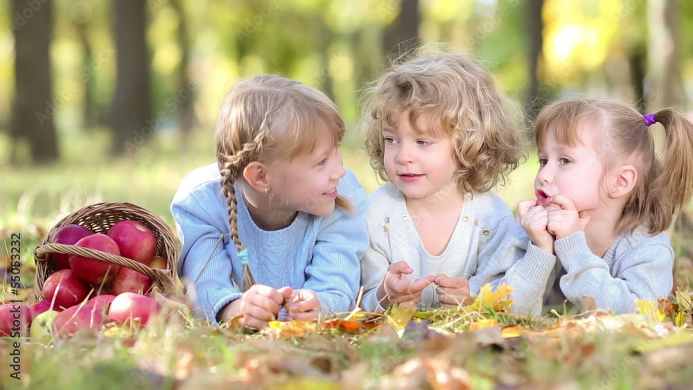 Group of happy children playing outdoors in autumn park Group of happy children playing outdoors in autumn park