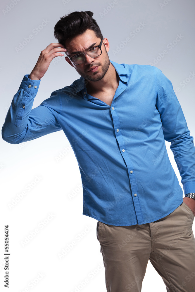 casual man scratches his head casual man scratches his head
