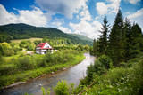 Rural view with river in Bieszczady mountains, Poland