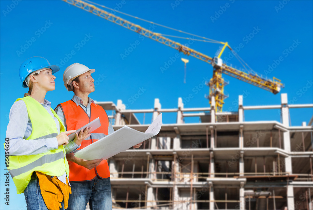 Foreman and engineer with blueprints Foreman and engineer with blueprints