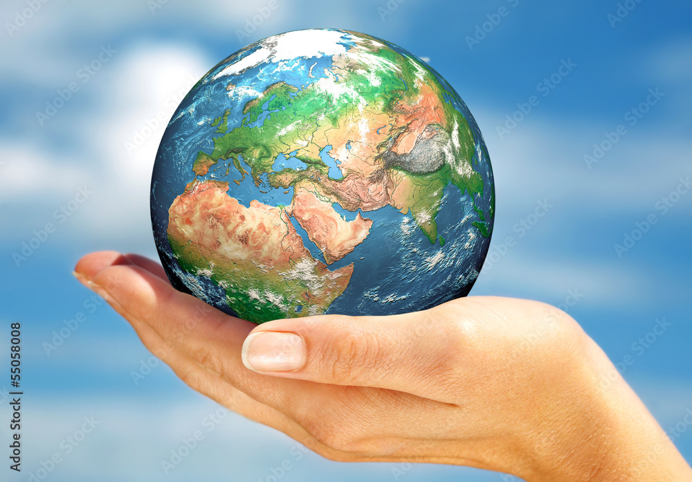 Hand of the person holds globe. Hand of the person holds globe.