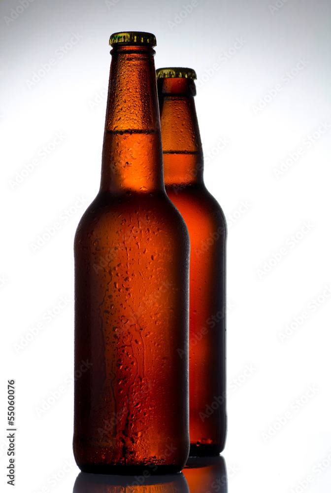 Beer bottles with water drops on white Beer bottles with water drops on white