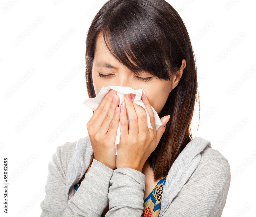 Sneezing woman isolated over white background Sneezing woman isolated over white background