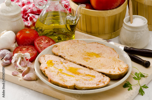 Spanish Cuisine. Tomato bread. Pa amb tomaquet. photo