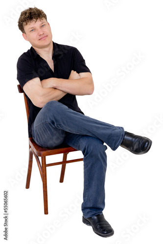 man sitting on a chair on a white background