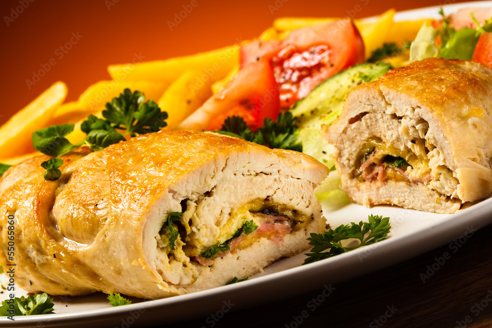 Fried wrapped meat, French fries and vegetables Fried wrapped meat, French fries and vegetables