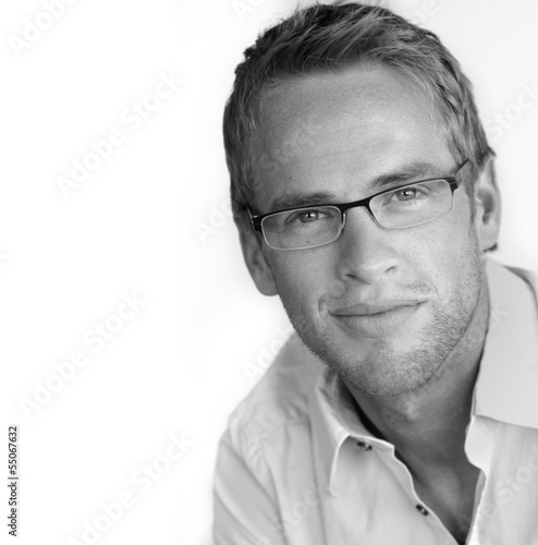 Good looking young businessman in stylish eyeglasses