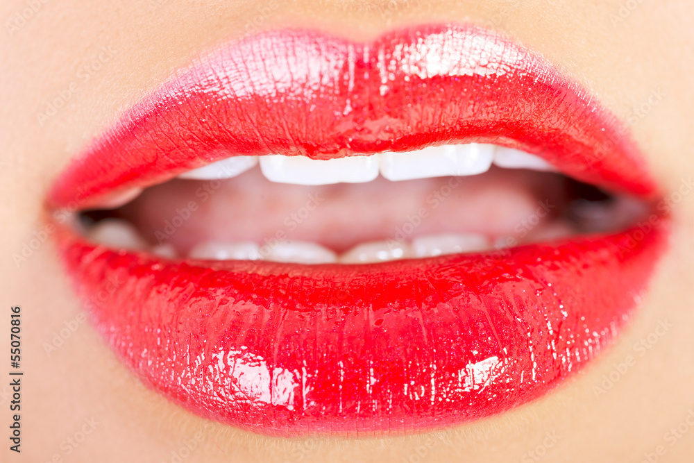Closeup shoot of beautiful lips of woman with red lipstick Closeup shoot of beautiful lips of woman with red lipstick