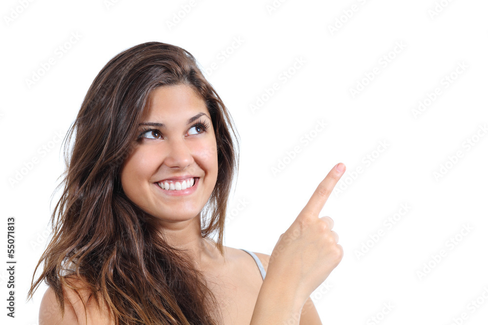 Close up of a beautiful woman pointing and looking above Close up of a beautiful woman pointing and looking above