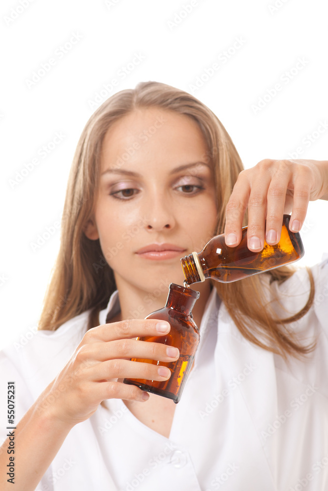 Fototapeta premium woman doctor with medication in glass bottles