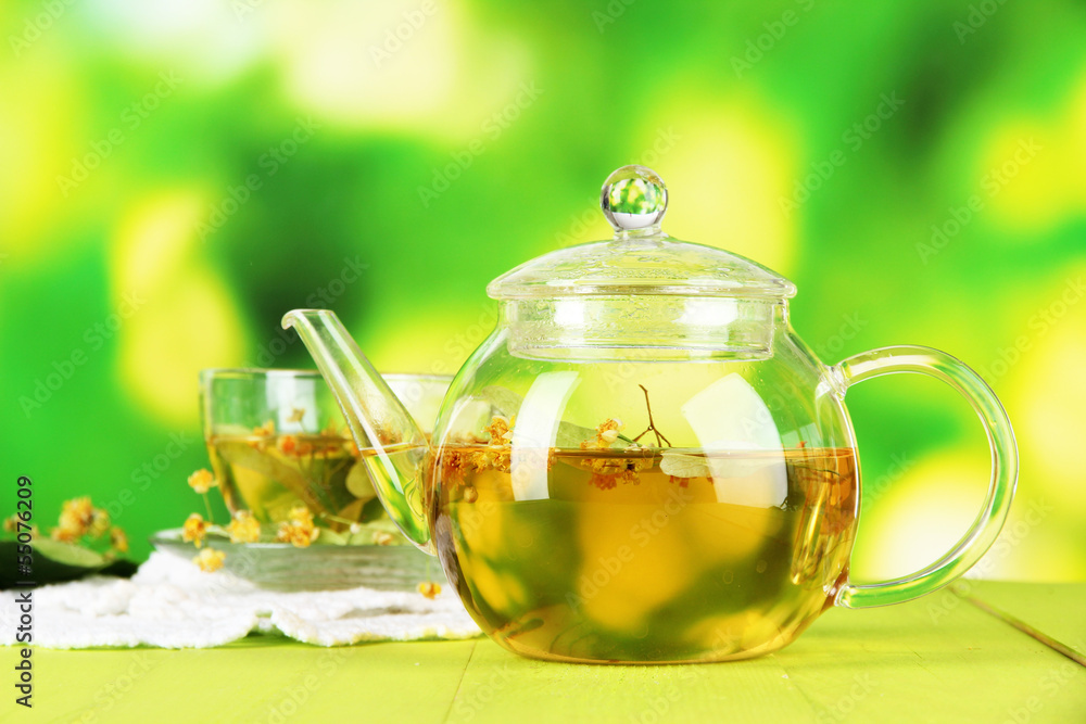 Kettle and cup of tea with linden Kettle and cup of tea with linden