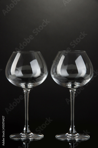 Empty wine glasses on grey background