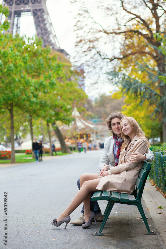 Romantic couple in Paris by the Eiffel Tower Romantic couple in Paris by the Eiffel Tower