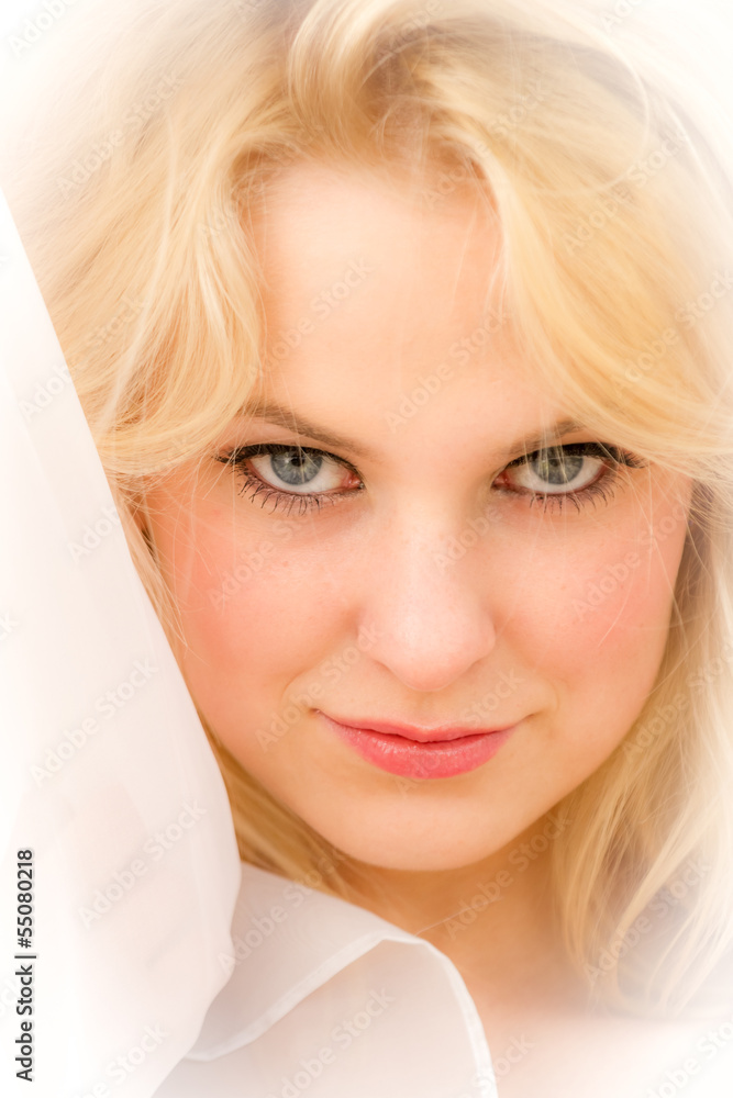 Face of a young woman on a white background Face of a young woman on a white background