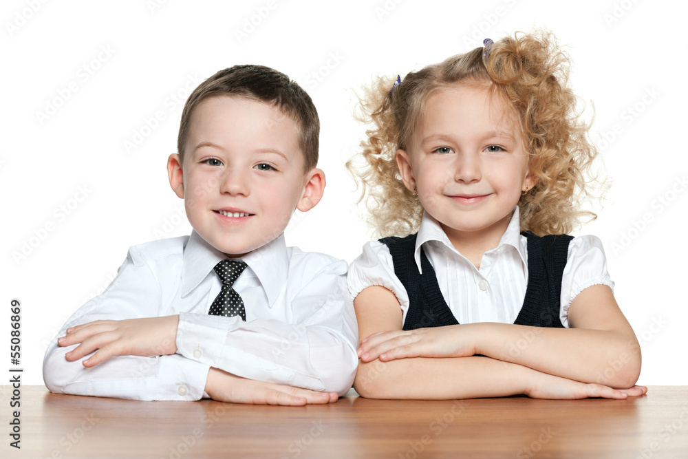Smiling children at the desk
