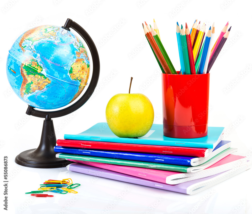 Naklejka premium Globe, notebook stack and pencils.