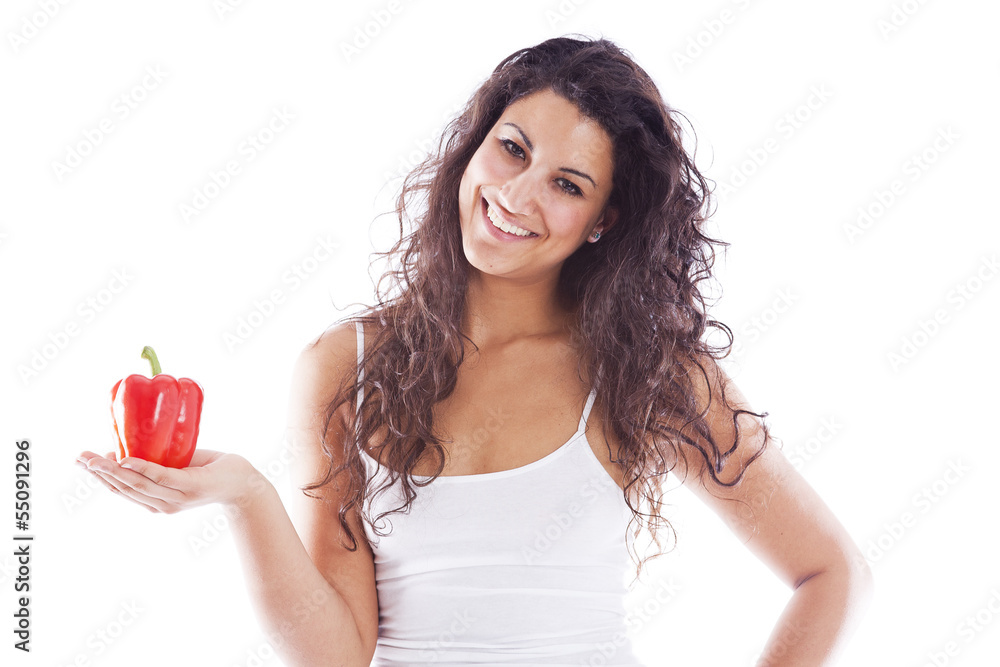 Healthy girl holding a red pepper