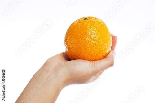 Hand holding an orange