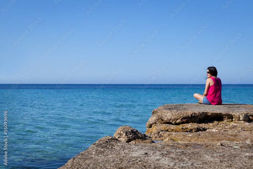 Woman Looking at Sea in an Old Dock