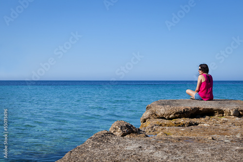 Woman Looking at Sea in an Old Dock
