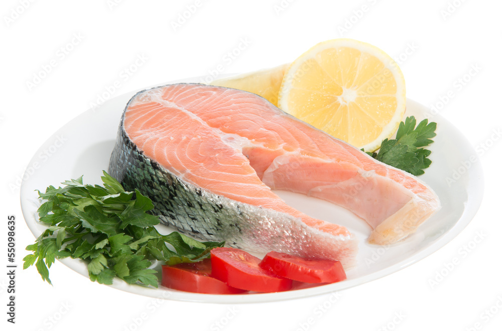Raw fresh salmon steaks red fish on a plate Raw fresh salmon steaks red fish on a plate