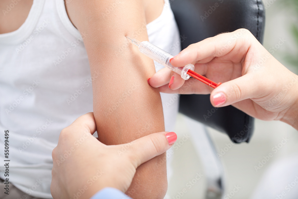 doctor making vaccination to the patient doctor making vaccination to the patient