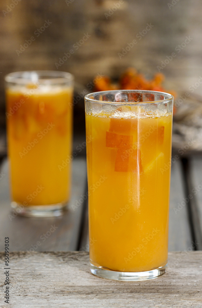 Orange drink on wooden table, selective focus Orange drink on wooden table, selective focus