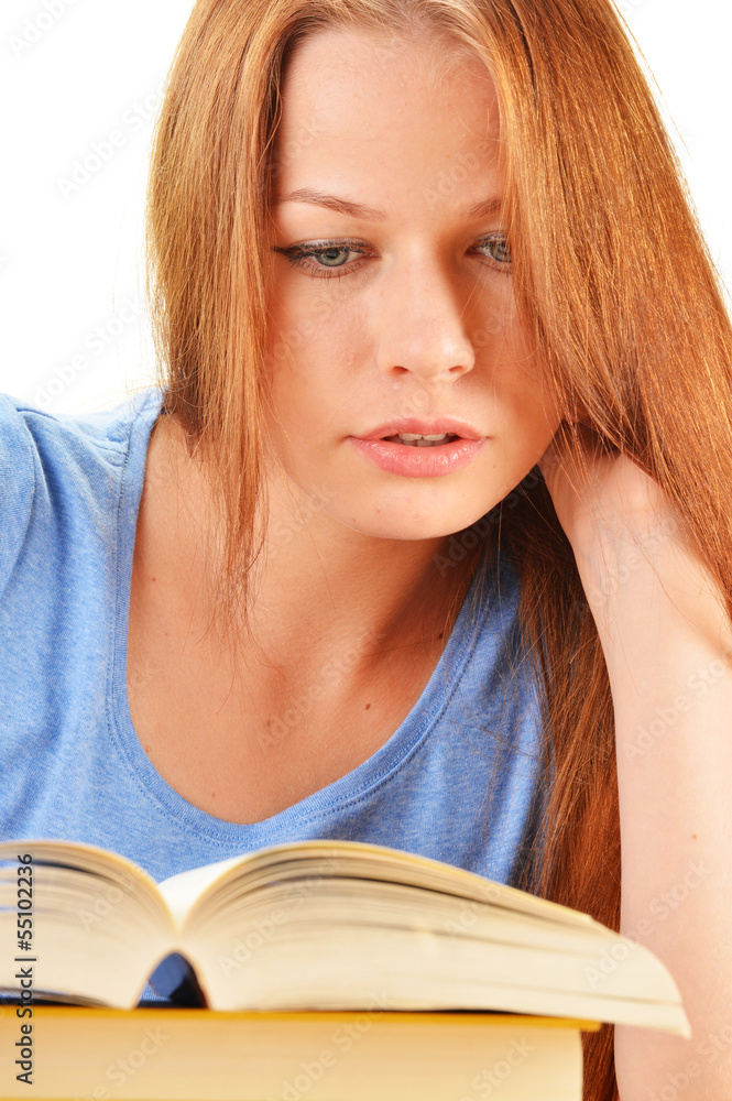 Young woman reading a book. Female student learning