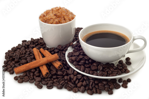 Coffee cup with beans and sugar on white background
