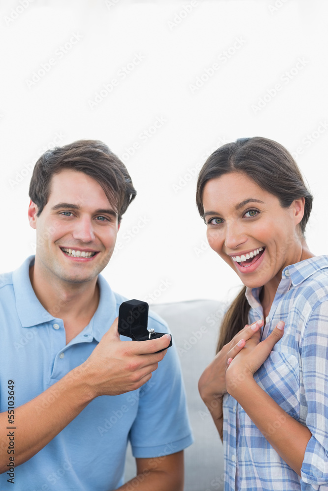 Portrait of a man offering an engagement ring to his partner Portrait of a man offering an engagement ring to his partner