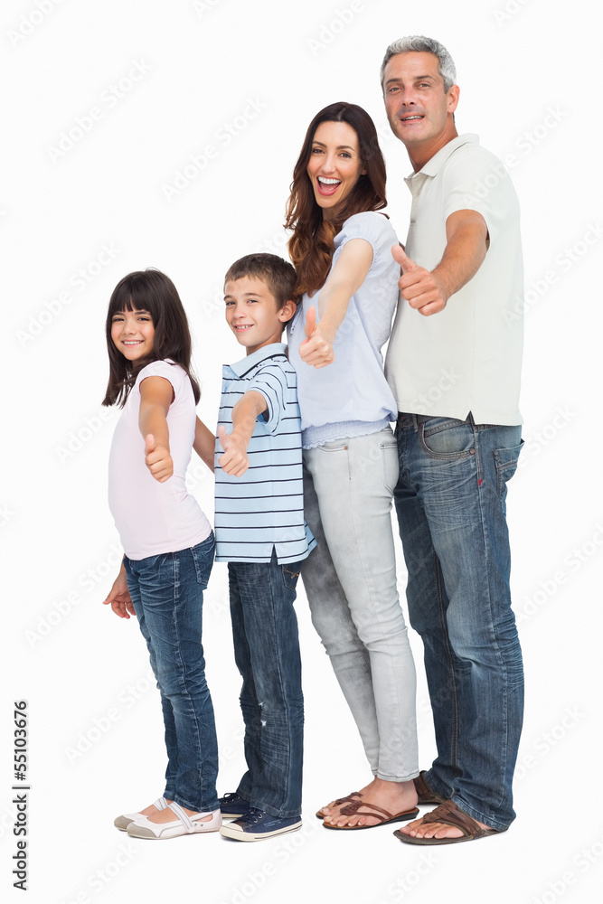 Portrait of a cute family in single file doing thumbs up at came Portrait of a cute family in single file doing thumbs up at came