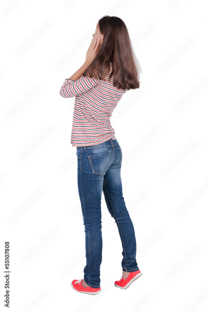 Back view of shocked woman in blue jeans. upset young brunete gi