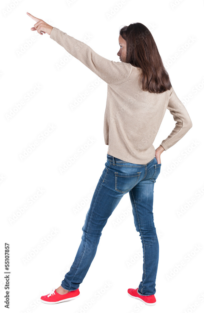 Back view of pointing woman. Back view of pointing woman.